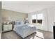 Bright bedroom with geometric wallpaper, plush carpet, and a large window letting in natural light at 3326 Wetherby Pl, Danville, IN 46122