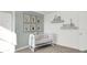 Charming Bedroom with a white crib, delightful decor, and soft lighting to create a comforting space at 3326 Wetherby Pl, Danville, IN 46122