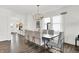 Bright dining area with dark table and seating, natural light, and an open floor plan at 3326 Wetherby Pl, Danville, IN 46122
