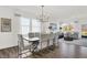 Dining room features a contemporary chandelier and an open-concept layout at 3326 Wetherby Pl, Danville, IN 46122