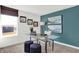 Modern home office with a glass desk, stylish decor, and a window with bright natural light at 3326 Wetherby Pl, Danville, IN 46122