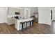 Spacious kitchen features stainless steel appliances, quartz countertops and a center island with seating at 3326 Wetherby Pl, Danville, IN 46122