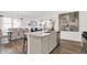 Open-concept kitchen with island, stainless appliances, and dining area at 3326 Wetherby Pl, Danville, IN 46122