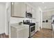 Well-equipped kitchen with stainless steel appliances, modern cabinetry, and wood look floors at 3326 Wetherby Pl, Danville, IN 46122