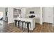 Modern kitchen featuring a large island with barstool seating, stainless steel appliances and countertops at 3326 Wetherby Pl, Danville, IN 46122