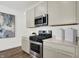 Modern kitchen features stainless steel oven and microwave with granite countertops at 3326 Wetherby Pl, Danville, IN 46122
