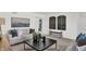 Comfortable living room featuring a neutral sofa, modern decor, and stylish accents at 3326 Wetherby Pl, Danville, IN 46122