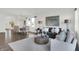 Bright, open-concept living room and dining area with wood floors and elegant furnishings at 3326 Wetherby Pl, Danville, IN 46122