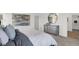 Comfortable main bedroom featuring a plush bed, dresser, a modern round mirror, and a walk-in closet at 3326 Wetherby Pl, Danville, IN 46122