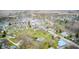 Aerial view of the town showing the location of the brick ranch house surrounded by trees at 345 E Main St, Jamestown, IN 46147