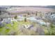 Discover a charming rural neighborhood with spacious lots, mature trees, and serene creek views from this aerial perspective at 345 E Main St, Jamestown, IN 46147