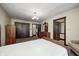 Bedroom featuring wood doors, wood dresser, and carpet with a floral pattern at 345 E Main St, Jamestown, IN 46147