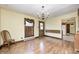 Dining room with hardwood floors, chandelier, and view to the front door at 345 E Main St, Jamestown, IN 46147