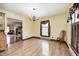 Bright dining room with chandelier, hardwood floors, and a view of the fireplace at 345 E Main St, Jamestown, IN 46147