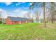 Traditional brick ranch home featuring green lawn, mature trees, and new roof at 345 E Main St, Jamestown, IN 46147