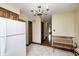 Kitchen featuring white refrigerator, hardwood floors, and built-in shelving at 345 E Main St, Jamestown, IN 46147