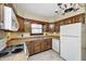 Kitchen with white appliances, oak cabinets, and tiled floor at 345 E Main St, Jamestown, IN 46147