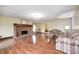 Bright living room with hardwood floors, a brick fireplace, and two comfortable couches at 345 E Main St, Jamestown, IN 46147