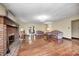 Spacious living room features hardwood floors, a cozy brick fireplace, and plenty of natural light at 345 E Main St, Jamestown, IN 46147