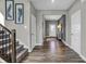 Inviting entryway with hardwood floors, a staircase, and an open view of the home at 3598 Planck Cir, Danville, IN 46122