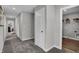 Light and airy hallway with carpet flooring, white trim, and access to various rooms at 3598 Planck Cir, Danville, IN 46122