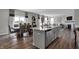 Open-concept kitchen and dining area with stainless appliances and large island at 3598 Planck Cir, Danville, IN 46122