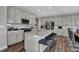 Bright kitchen with a large island, stainless steel appliances, and ample cabinet space at 3598 Planck Cir, Danville, IN 46122