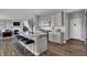Modern kitchen featuring an island with bar seating, stainless appliances, and ample counter space at 3598 Planck Cir, Danville, IN 46122