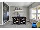Brightly lit study with a fun chalkboard wall and shelving with natural light at 3598 Planck Cir, Danville, IN 46122