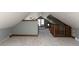 Spacious attic area with sloped ceilings and carpet, ready for customization at 4030 N Illinois St, Indianapolis, IN 46208