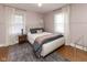 Cozy bedroom with hardwood floors, light walls, and large windows offers a comfortable retreat at 4030 N Illinois St, Indianapolis, IN 46208