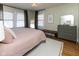 Inviting bedroom features natural light, wood floors, and neutral tones for a calming retreat at 4030 N Illinois St, Indianapolis, IN 46208