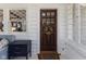 Inviting front door and entry with sidelight window and white brick wall at 4030 N Illinois St, Indianapolis, IN 46208