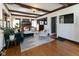 Spacious living room with hardwood floors, dark wood trim and a brick fireplace at 4030 N Illinois St, Indianapolis, IN 46208