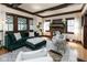 Inviting living room featuring hardwood floors, an area rug, and a brick fireplace at 4030 N Illinois St, Indianapolis, IN 46208