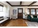 Cozy living room with hardwood floors, dark wood trim, and stylish furniture at 4030 N Illinois St, Indianapolis, IN 46208