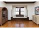 Comfortable living room with hardwood floors, a window seat and plenty of natural light at 4030 N Illinois St, Indianapolis, IN 46208