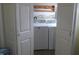 Convenient laundry area with a washer and dryer, tucked behind closet doors for a neat appearance at 406 W Jackson St, Alexandria, IN 46001