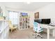 Bright bedroom features a work space and plenty of display shelving for storing collectibles at 4196 Parliament Way, Avon, IN 46123