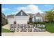 Charming two-story home with a two-car garage, manicured lawn, and stylish exterior finishes at 4196 Parliament Way, Avon, IN 46123