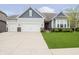 Inviting two-story home with light gray siding, well-maintained landscaping, and a spacious concrete driveway at 4196 Parliament Way, Avon, IN 46123
