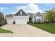 Inviting two-story home with light gray siding, well-maintained landscaping, and a spacious concrete driveway at 4196 Parliament Way, Avon, IN 46123