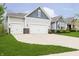 Charming two-story home featuring a two-car garage, light gray siding, and a well-manicured lawn at 4196 Parliament Way, Avon, IN 46123
