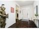 Welcoming foyer featuring gleaming wood floors, knight decor, and an abundance of natural light at 4196 Parliament Way, Avon, IN 46123