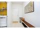 Bright hallway with white walls, a tiled floor, and a wooden bench with a storage shelf below at 4196 Parliament Way, Avon, IN 46123