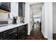 Kitchen featuring dark cabinetry, quartz countertops, subway tile backsplash, and stainless steel appliances at 4196 Parliament Way, Avon, IN 46123