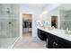 Luxury main bathroom featuring a glass shower, double vanity sinks, and a view to walk-in closet at 4196 Parliament Way, Avon, IN 46123