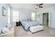 Comfortable main bedroom featuring a ceiling fan, plenty of natural light, and ensuite bathroom at 4196 Parliament Way, Avon, IN 46123