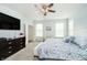 Spacious main bedroom boasting a ceiling fan, carpet flooring, and natural light from large windows at 4196 Parliament Way, Avon, IN 46123