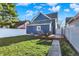 Backyard featuring a cozy deck with outdoor seating and a well-maintained lawn, ideal for relaxing and entertaining at 424 N Randolph St, Indianapolis, IN 46201